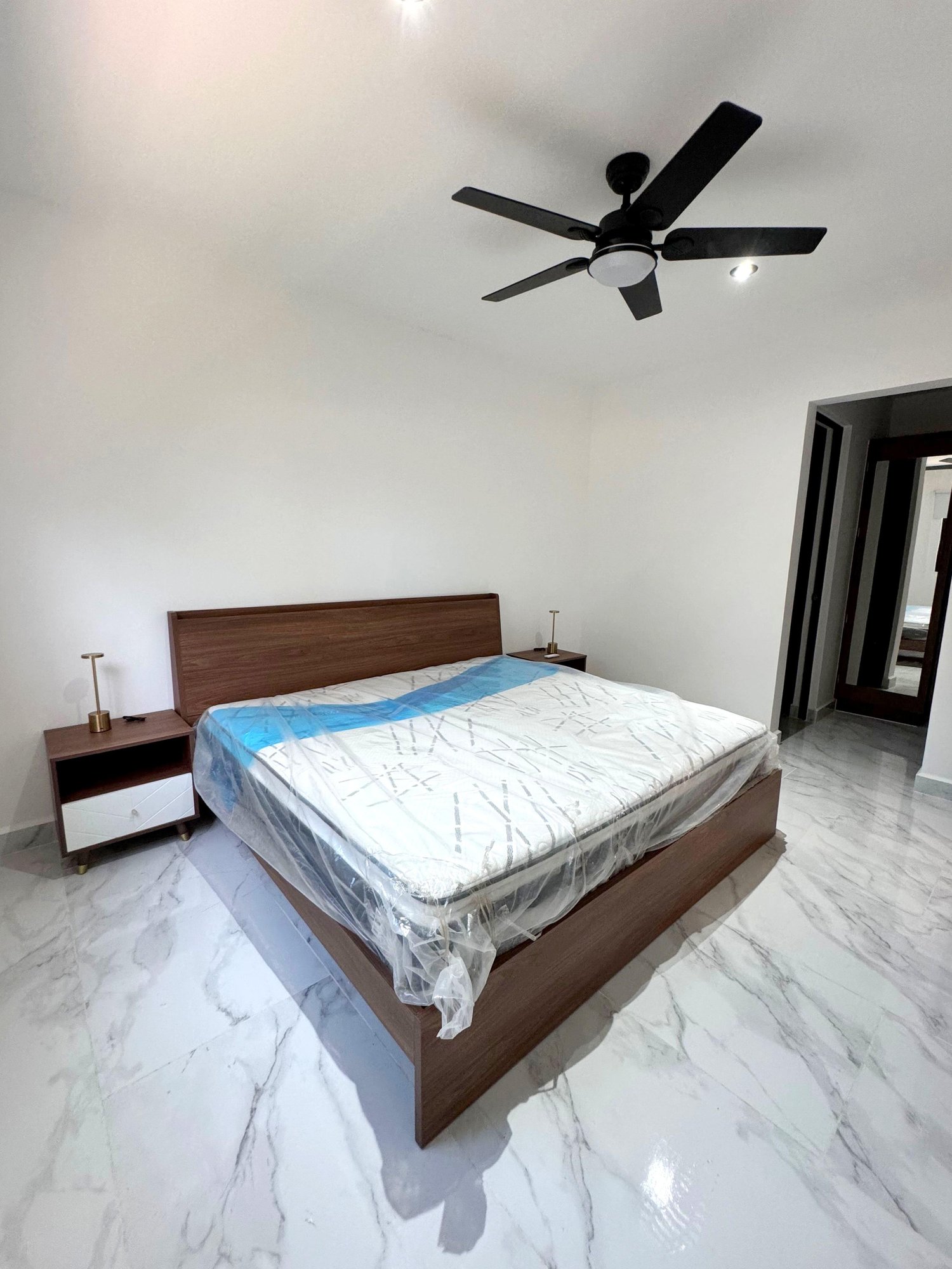 Spacious master bedroom with modern design in a furnished apartment for rent in Playa del Carmen – La Selva Residences