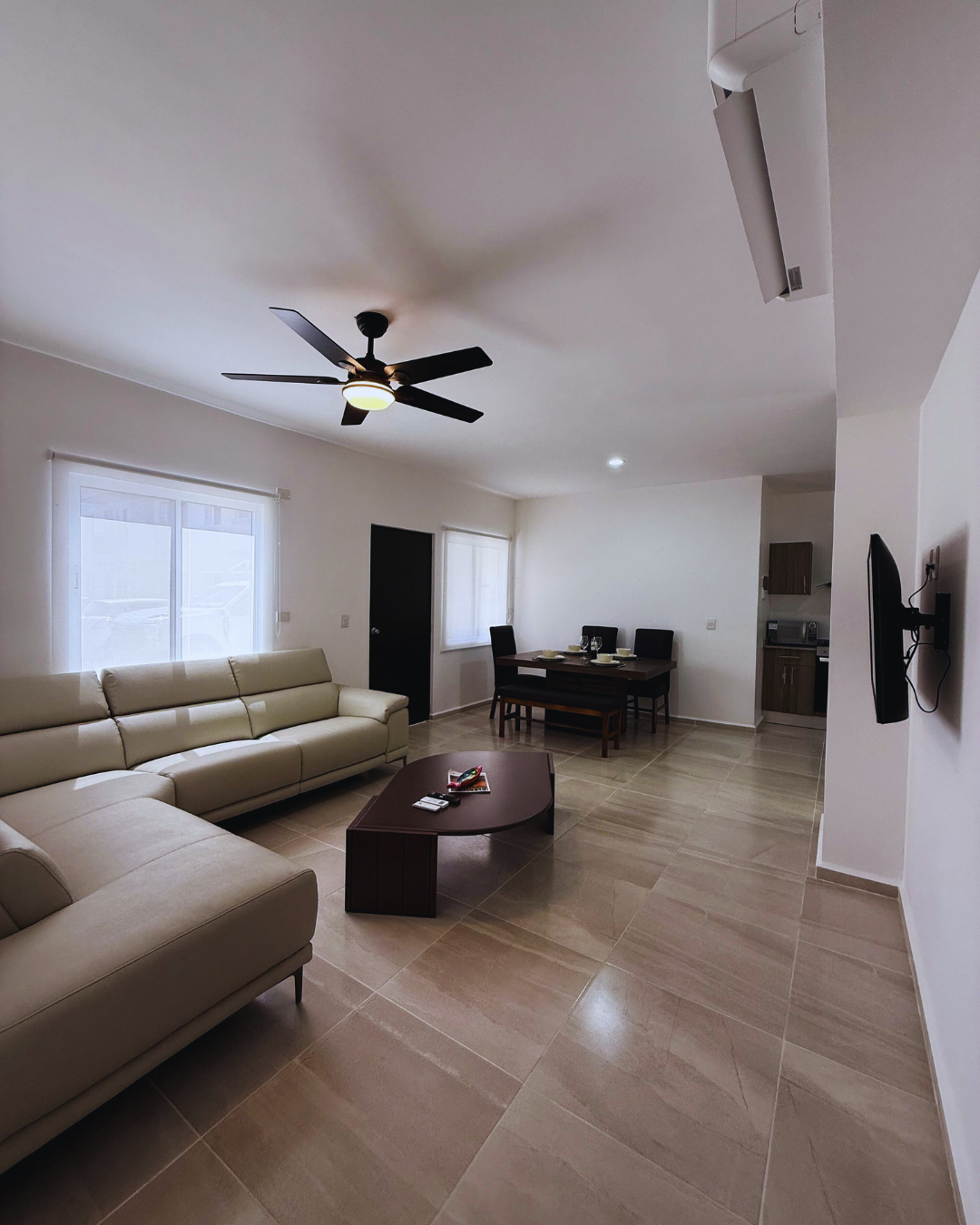 Furnished living room with air conditioning and TV