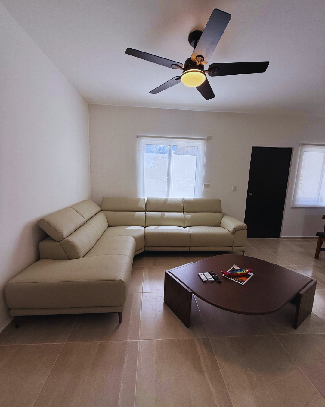Furnished living room with air conditioning and TV